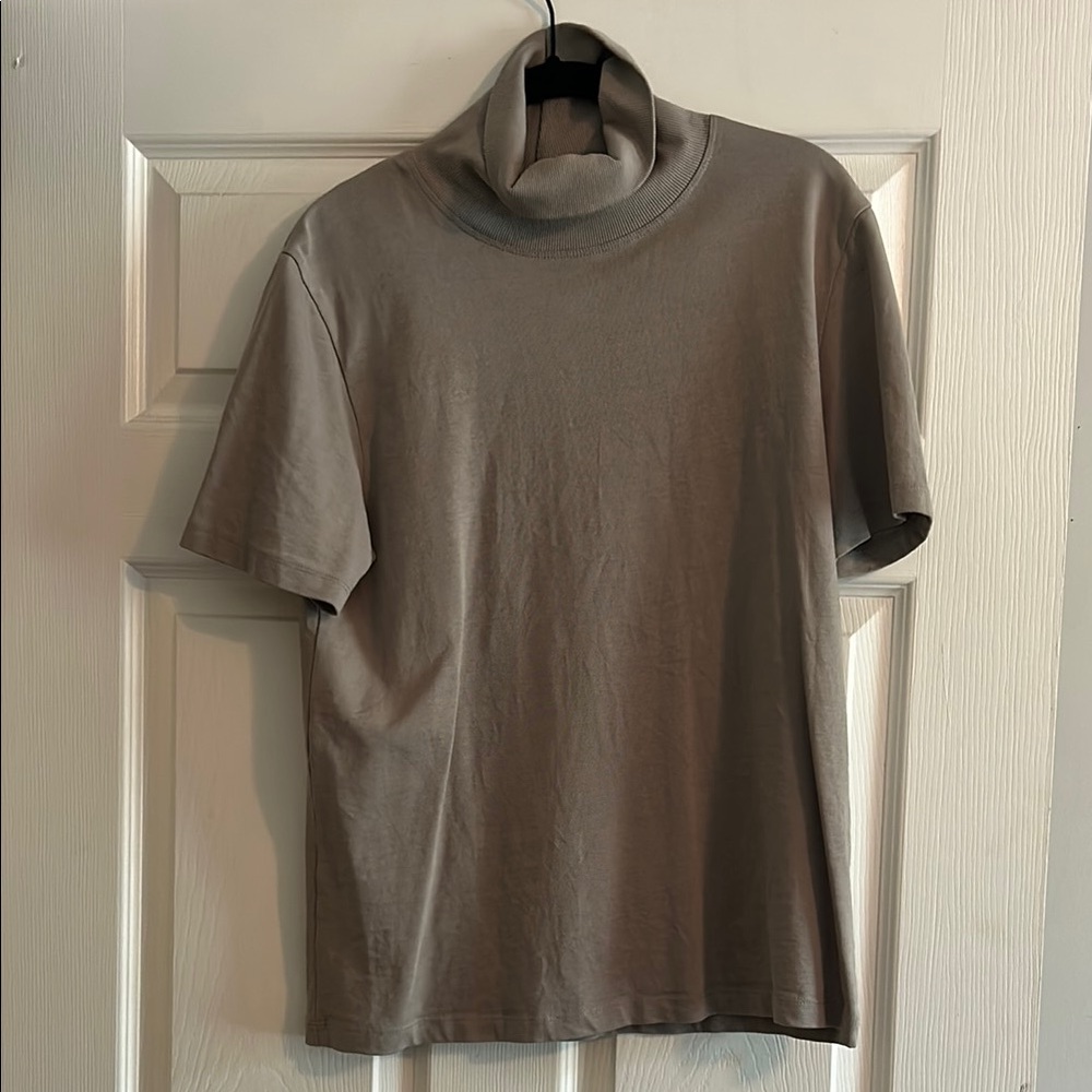 Women’s Classic Tan Turtleneck Shirt

P2P 18 in, length 25 in